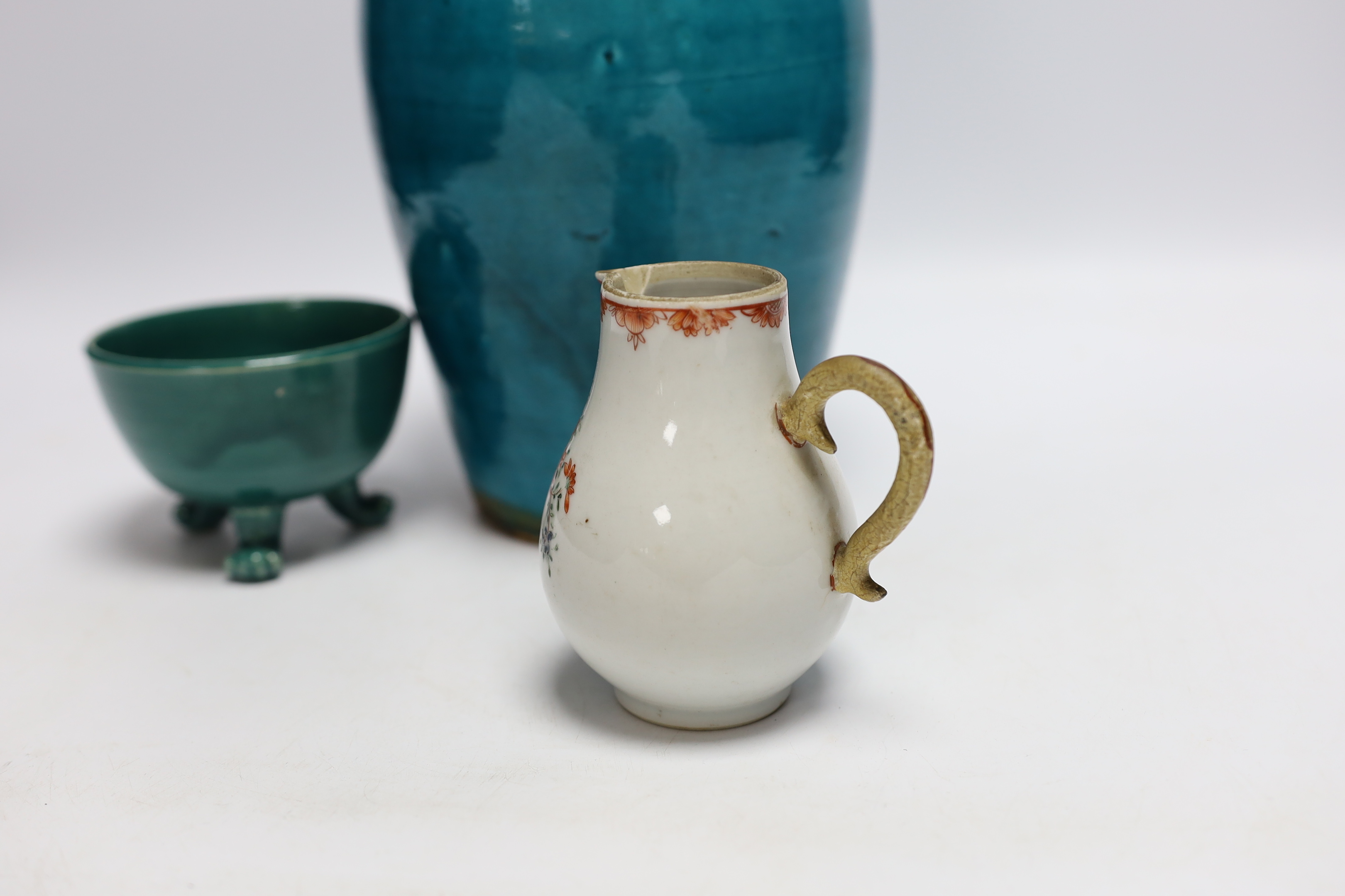 A turquoise glazed three footed bowl and jug and a small Chinese famille rose jug, largest 25cm high